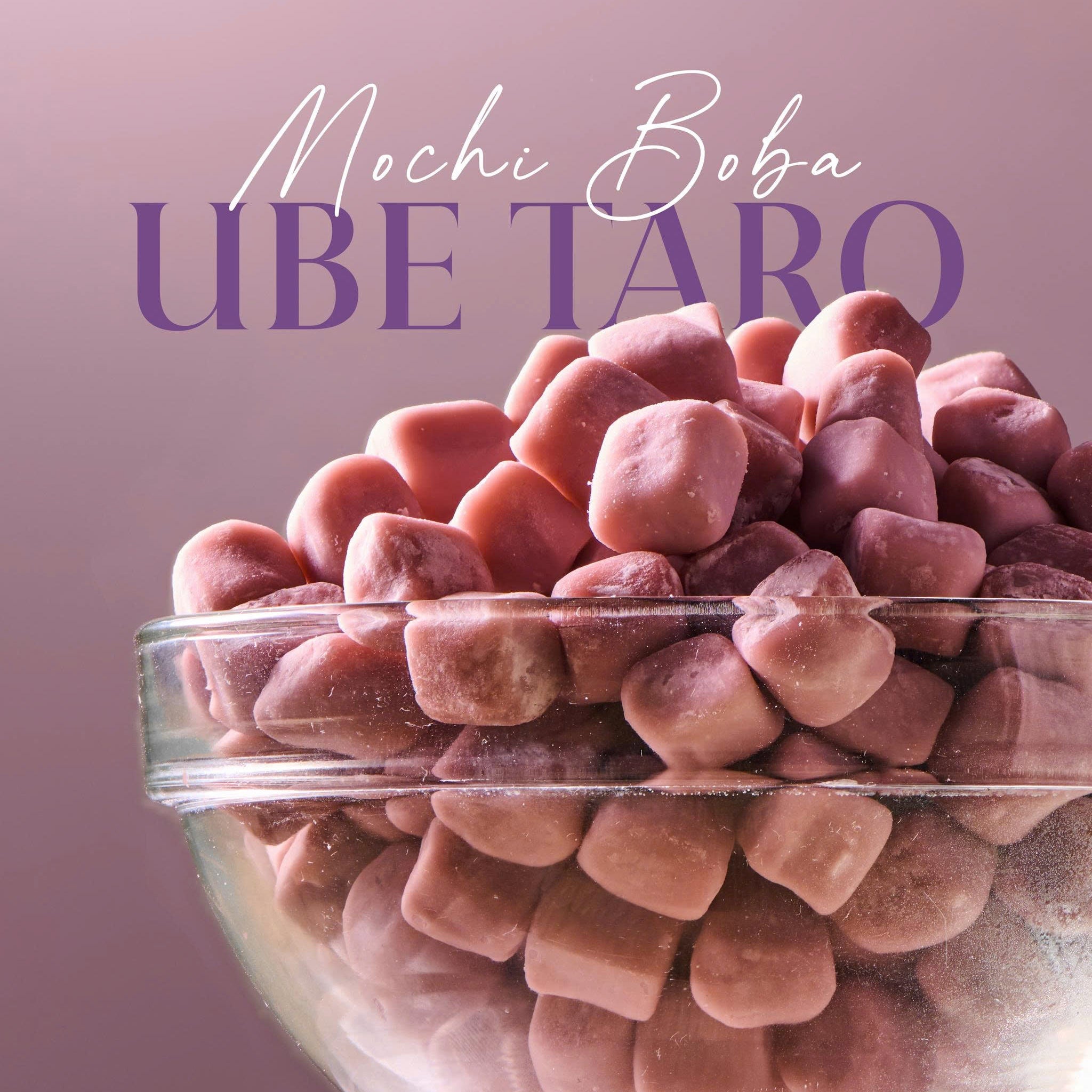 Glass bowl filled with pink Ube Taro mochi boba on a pink background
